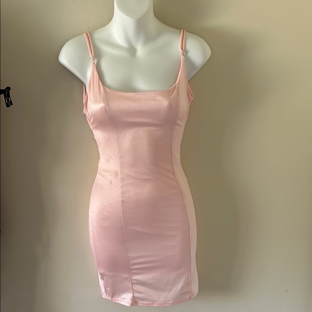 Pink satin dress from Lucy in the sky
Has adjustable straps 
Very comfortable!